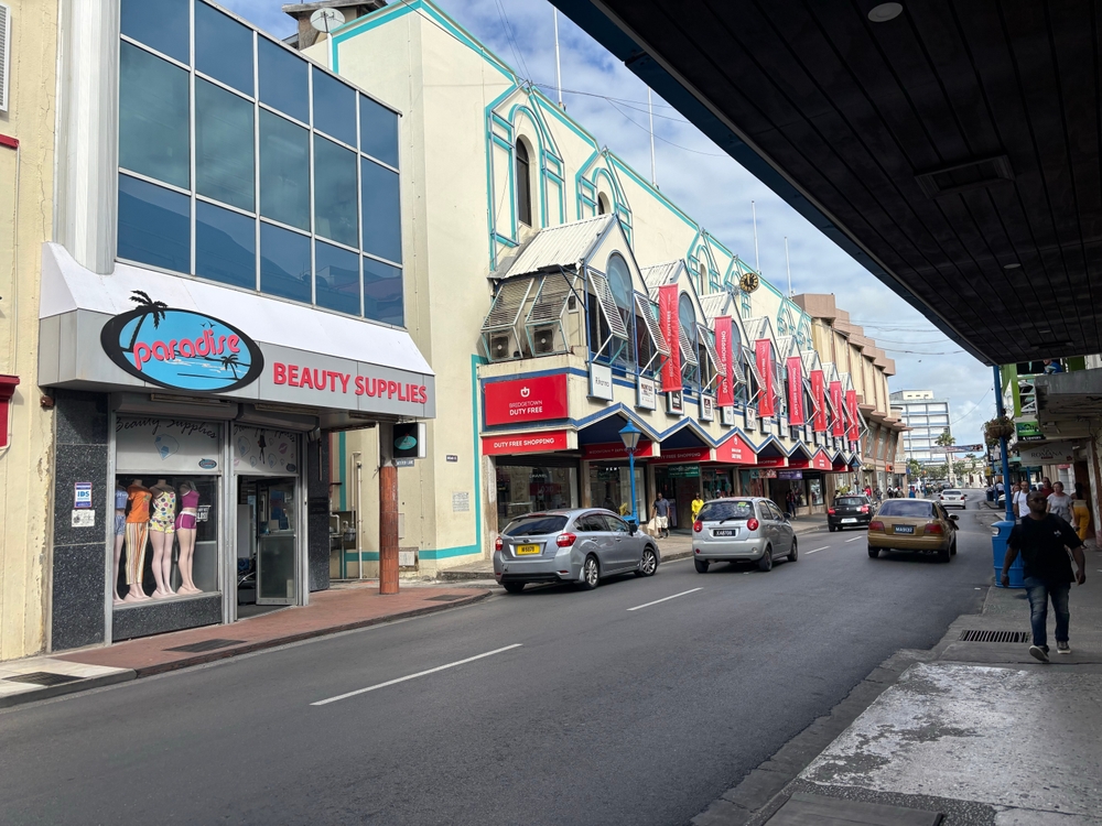 View of tourists and locals walking along Broad Street, which is the centre of the city with all of the major banks, restaurants, shops, and malls