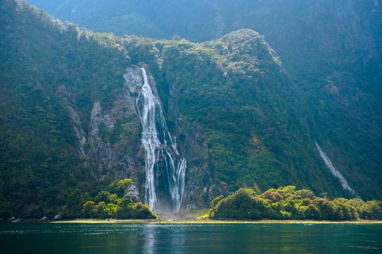 The Peaks and Valleys of Milford Sound Waterfall of high mountain glacier at milford sound, New Zealand. Image: AdobeStock
