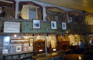 12Tombstone -- cage-styled prostitues' cribs (rooms) hang from ceiling in Birdcage Theater