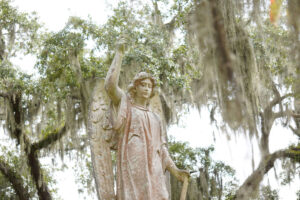 Angel statue atop grave