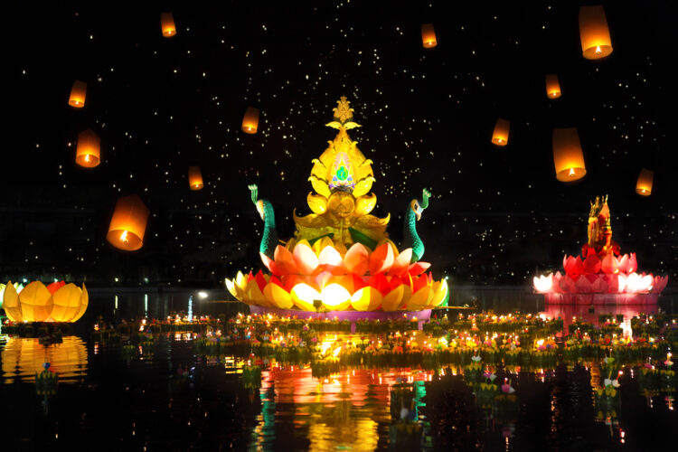 Big and small boats with candles and flowers are given for Thailands traditional Loy Krathong Festival
