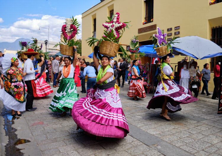Women dancing in traditional Mexican dresses 