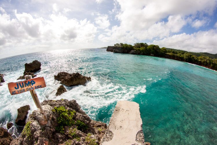 Boston Beach with turquoise water and cliff jumping place from the cliffs