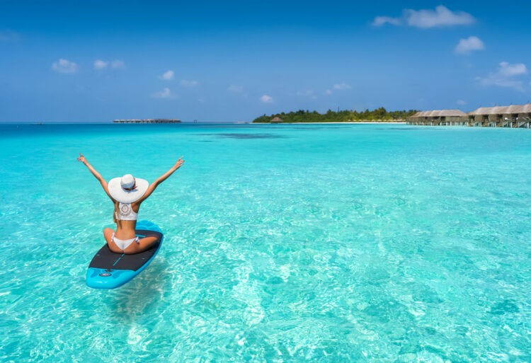 Woman on paddle board in the Maldives