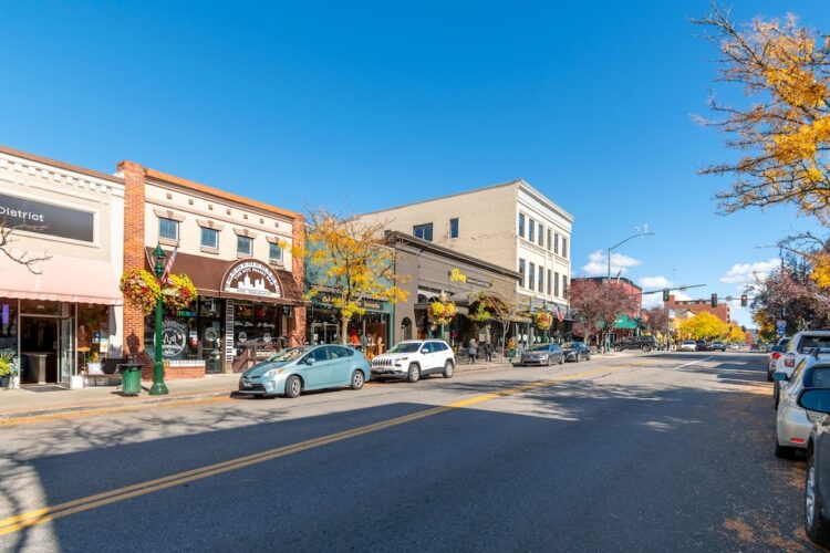 Coeur d'Alene, Idaho USA - October 18 2021: The main street Sherman Avenue near 4th street in the historic lakeside downtown of Coeur d'Alene, Idaho, USA at autumn.