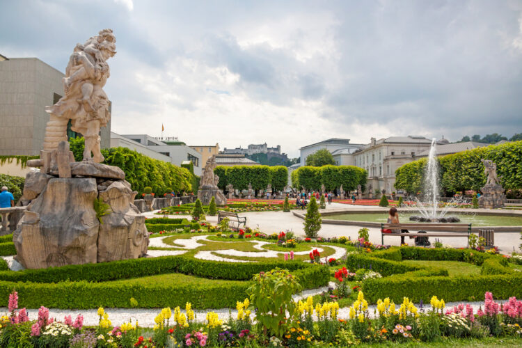 View of famous Mirabell Garden with the old historic Fortress Hohensalzburg in the background in Salzburg,