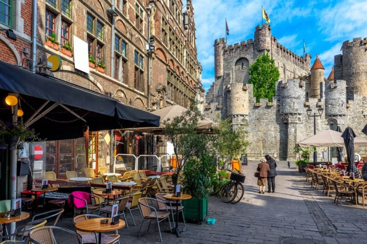 Old street with tables of cafe in Ghent 