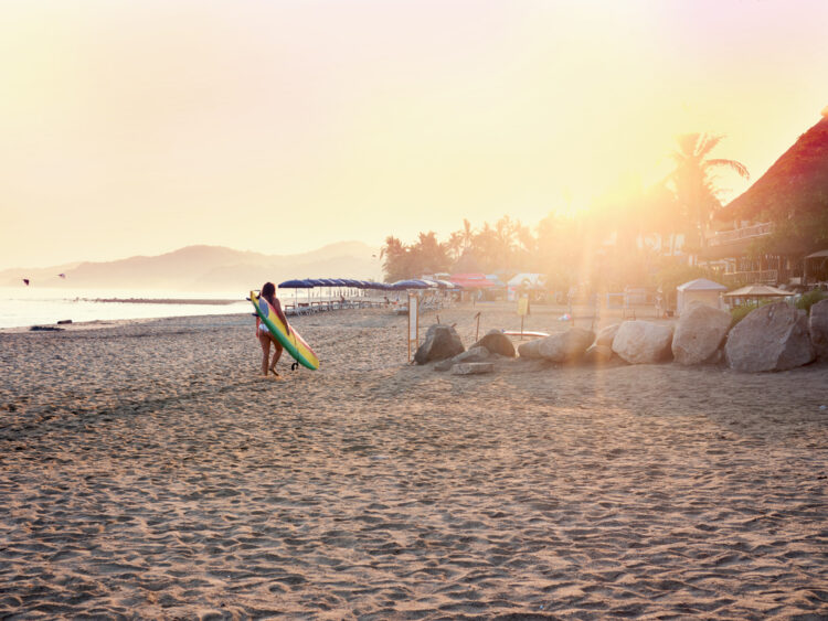 Surfer at sunrise. Sayulita Mexico