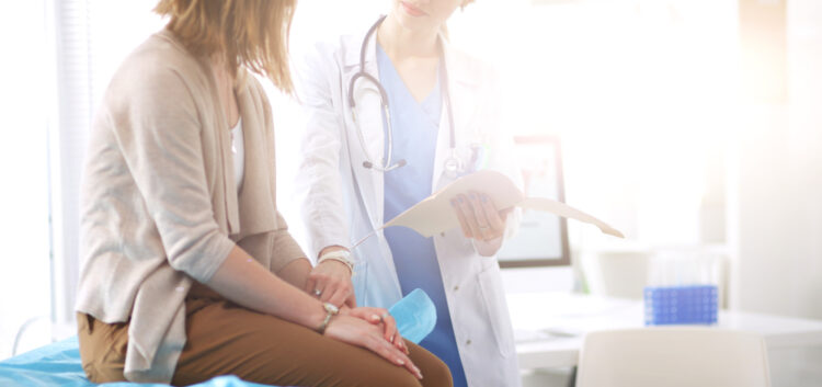 A doctor speaks with a patient
