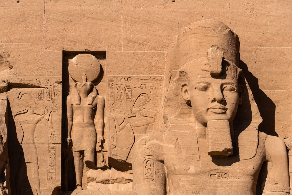 Exterior view of the majestic statues of Ramses II that ornate the facade of the famous Abu Simbel temple