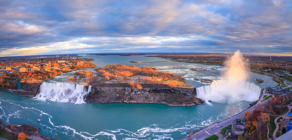 Niagara Falls: What the Mist Doesn’t Tell You Niagara Falls boat tours attraction. Horseshoe Falls at Niagara Falls, Ontario, Canada