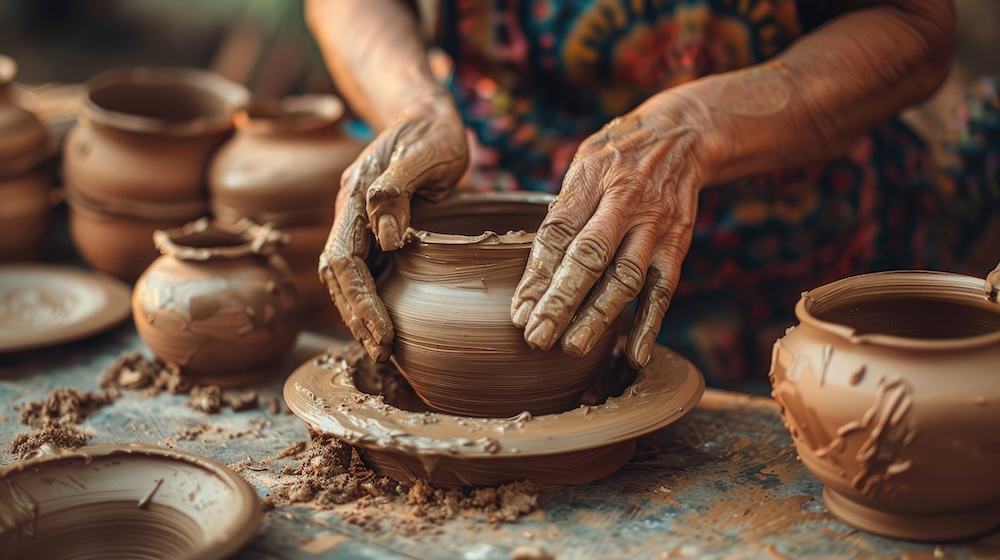 Potter shaping clay